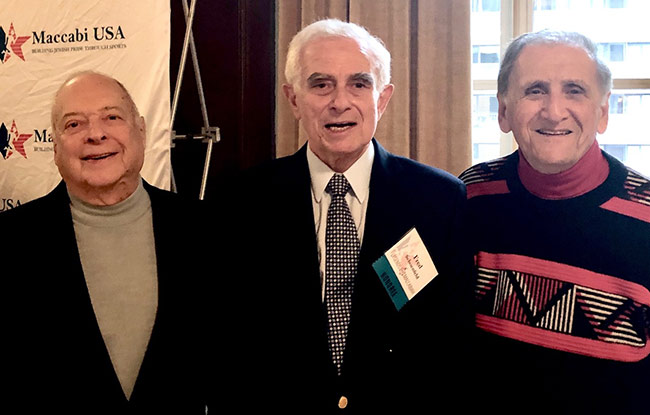 Hall of Fame executive board member Bill Steerman, left; Fred Schoenfeld, recipient of the Legends of the Maccabiah Award, center; and IJSHOF chairman Alan Sherman, right; in early December at the New York Athletic Club.